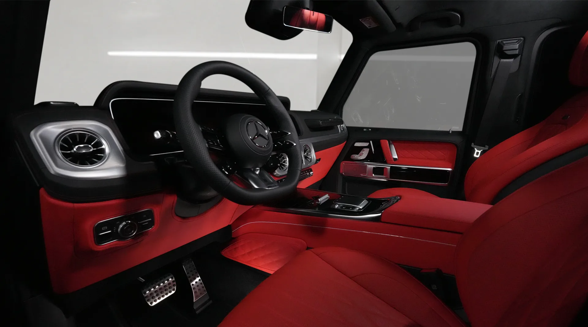 Own the Mercedes-Benz G63 AMG, finished in Magno Black and featuring a contrasting Red interior.