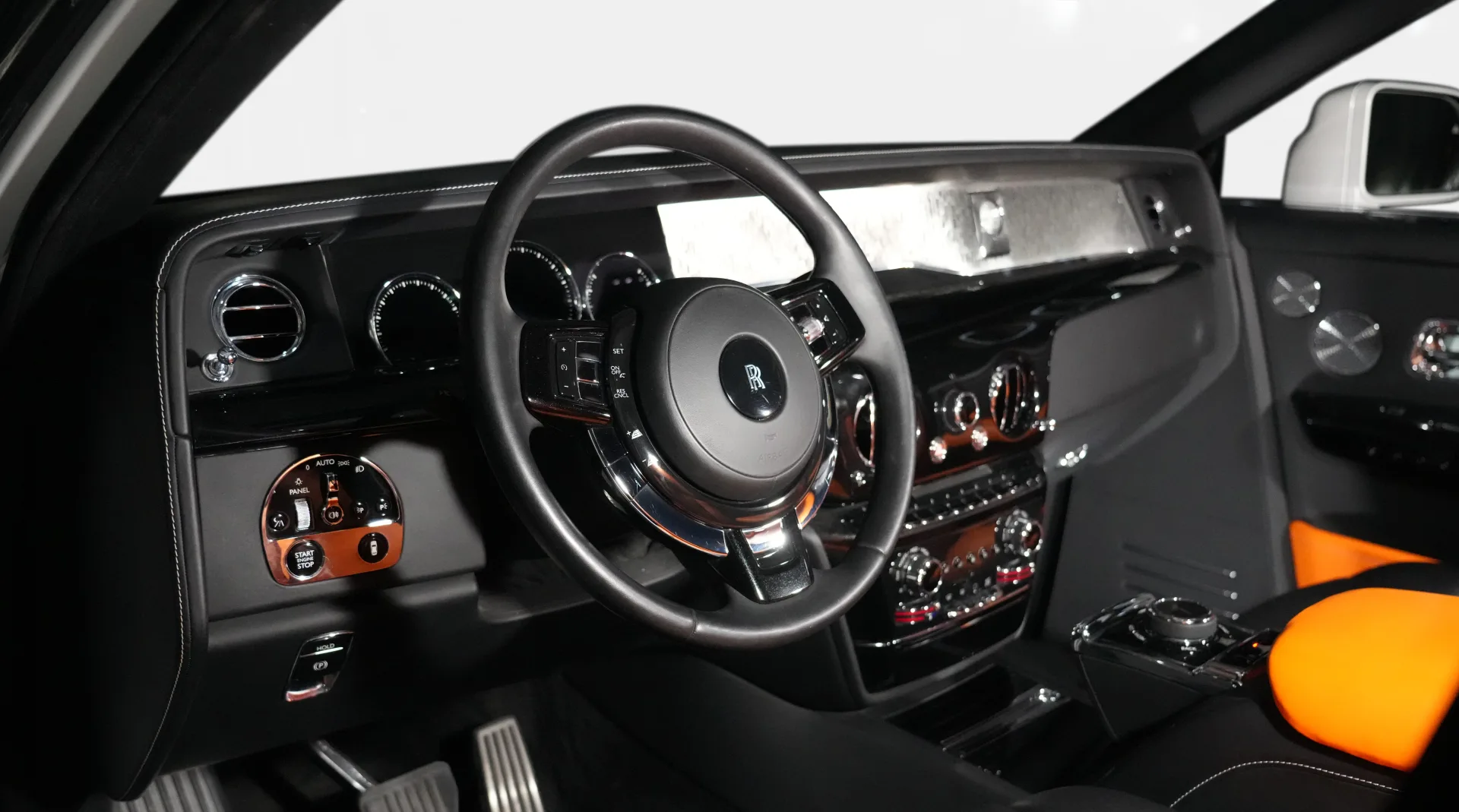 Experience the Rolls-Royce Phantom SPOFEC / NOVITEC Limited Edition with its two-tone Diamond Black & English White exterior, Mandarin & Black interior, and bespoke luxury features.