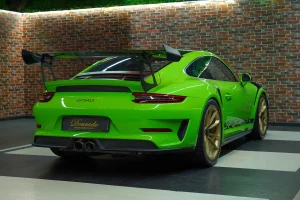 Porsche 911 GT3 RS in Green Luxury Car Dealership in Dubai