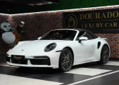 Buy Porsche 911 Turbo S Cabriolet in white in Dubai